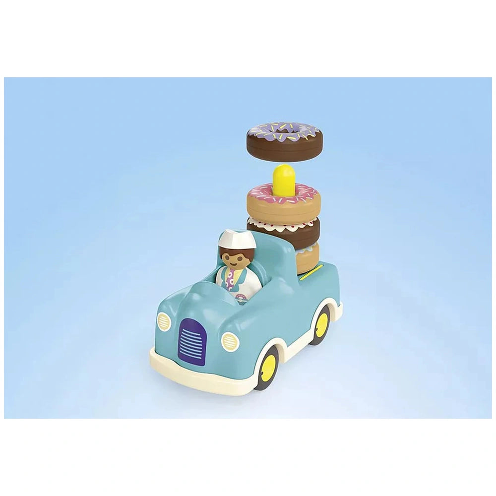Playmobil Crazy-Donut-Truck features a blue plastic body, yellow wheels, and a matte finish with multiple white details.