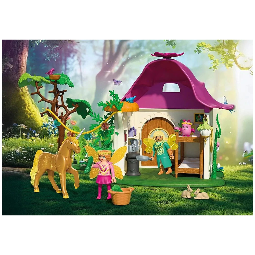 Playmobil Magic Unicorns Cozy Fairy Home features a pink roof and extensive wooden furniture, including a bed, table, and bat