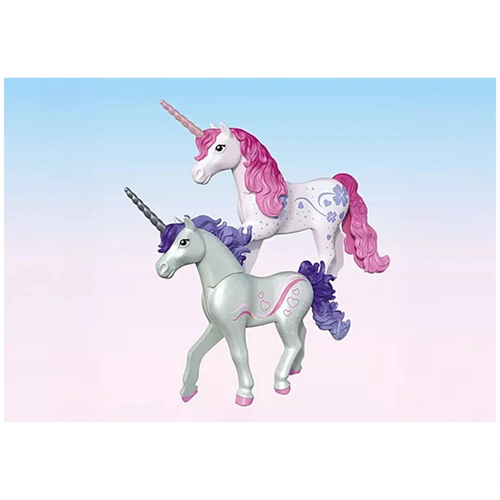 Playmobil Magical Unicorn Stable features two shiny unicorn figurines, one with a purple mane and the other with a pink mane.