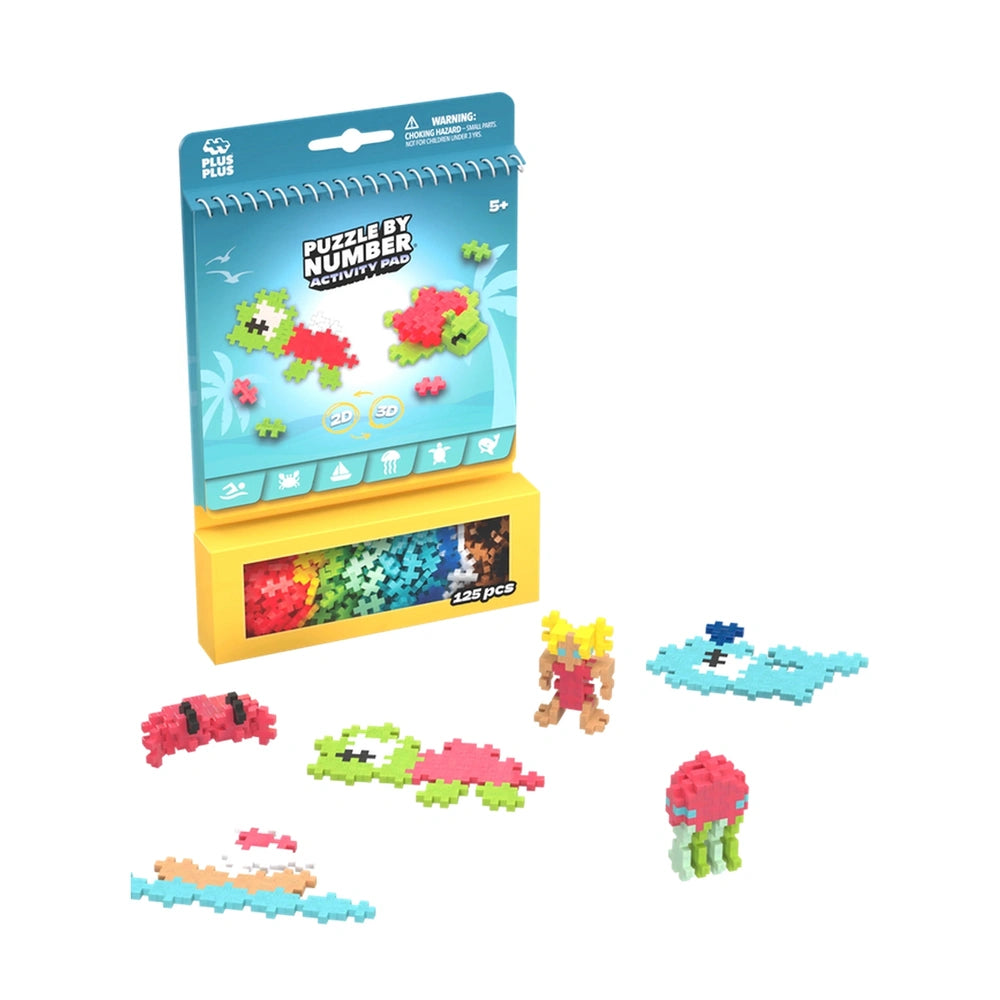 Plus Plus Ocean Activity Pad features a multicolored puzzle with 123 pieces, displayed in glossy cardboard packaging with a c