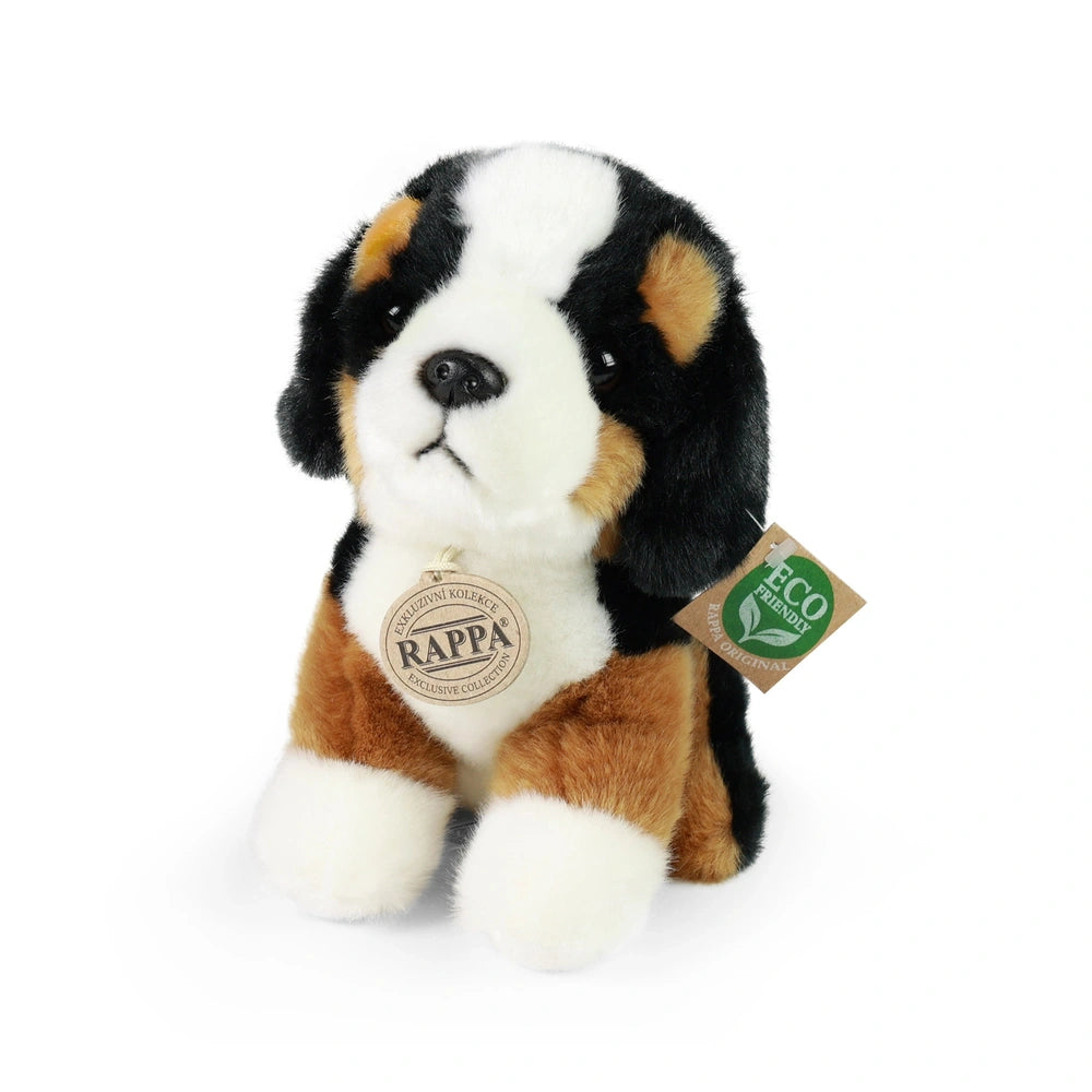 Plush mountain dog stuffed animal with brown and white fur, soft texture, and an "ECO FRIENDLY" tag on its collar.