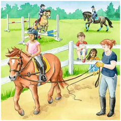 A young girl in a pink shirt rides a brown horse with a white blaze in a vibrant rural riding stable scene.