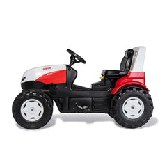 Rollyfarmtrac Premium II Steyr 6300 Terrus CVT riding toy features a black body with red accents and a comfortable seat.