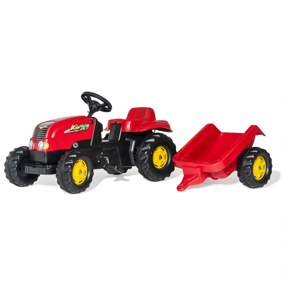 Rolly Toys Rollykid-X Tractor in red with black tires and yellow rims, accompanied by a matching trailer, both made of glossy