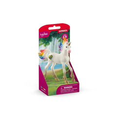 Rainbow Love Unicorn Foal in glossy white with a rainbow mane, displayed in red packaging with a clear window.
