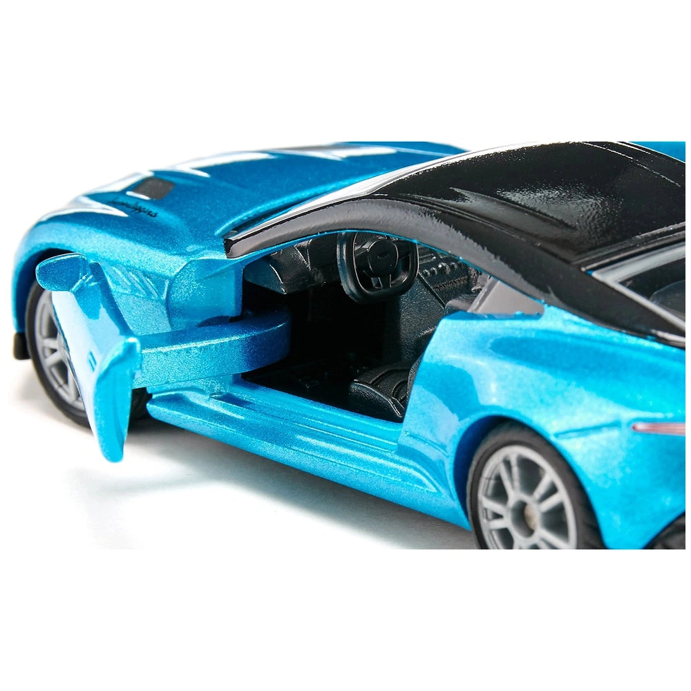 Siku Aston Martin DBS Superleggera toy car in blue with an open door, showcasing a glossy interior and black accents.