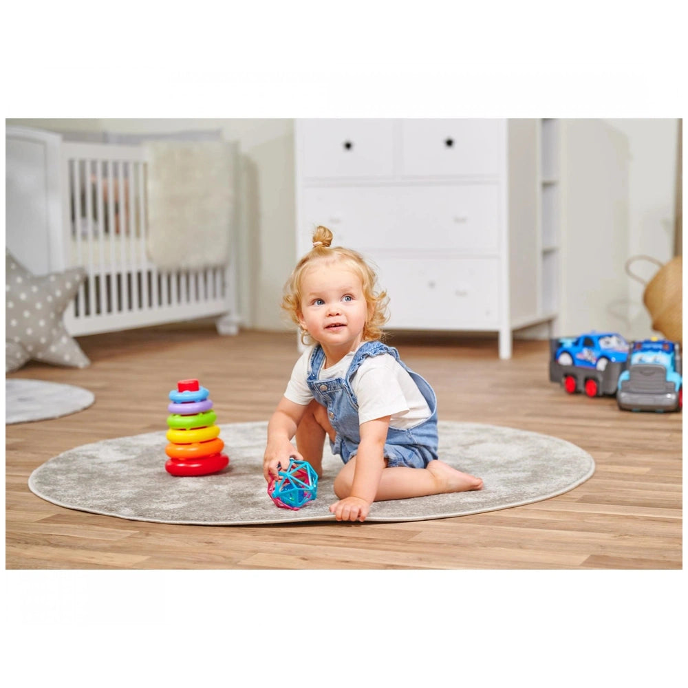 Simba ABC Stacking Ring Pyramid with toddler playing on a light rug, surrounded by colorful toys in a cozy child’s room.