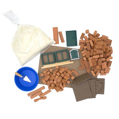 Teifoc house building set with 185 pieces, including wooden planks, bricks, a toolbox, and adhesive materials on a brown surf