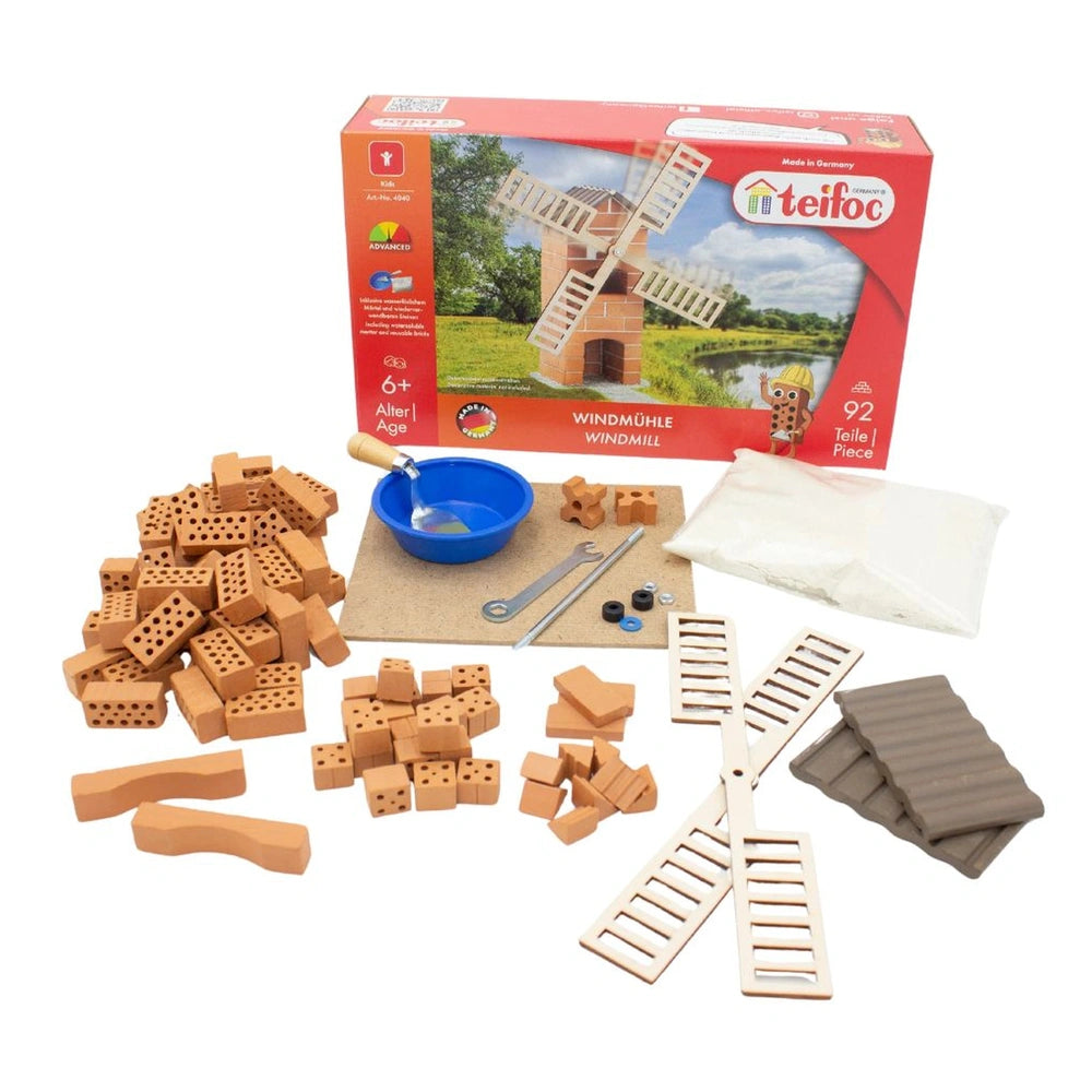 Teifoc windmill arts and crafts kit in an orange box, featuring colorful plastic pegs, a blue bowl, and a metal tool.